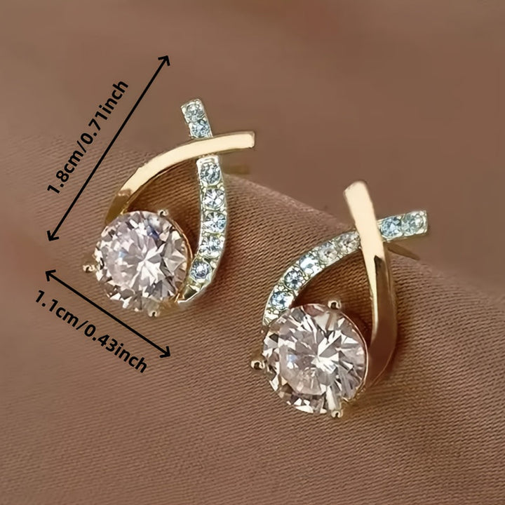 Boucles d'oreilles à puce avec croix dorée et zirconiums